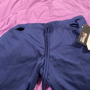Women’s navy blue greys anatomy scrub pants.